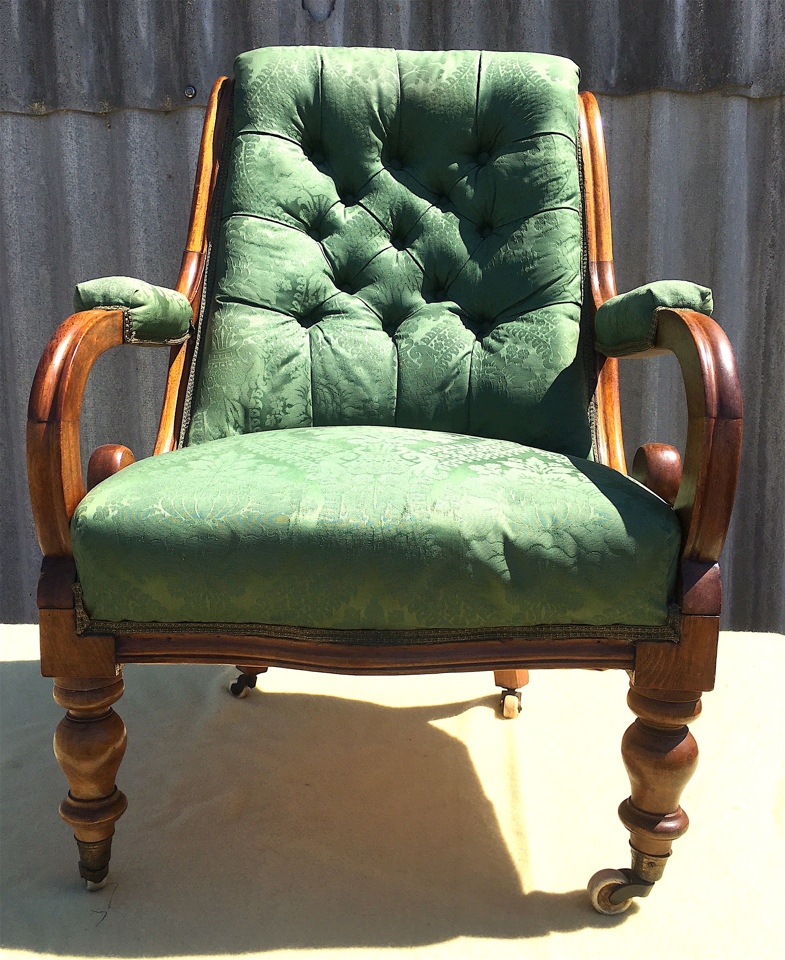 A mid Victorian upholstered mahogany armchair, width 66cm, depth 70cm, height 94cm